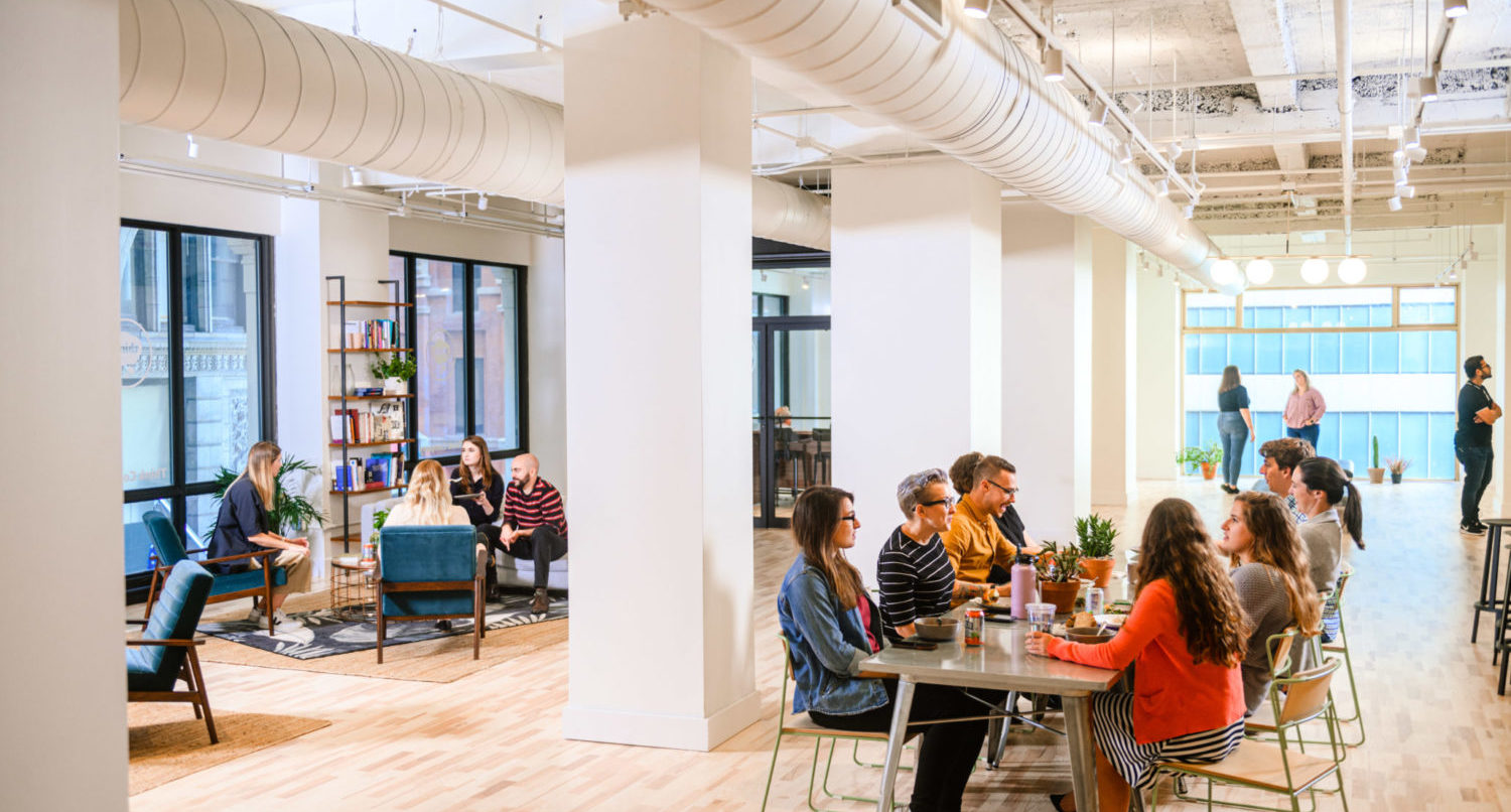 Employees socializing together in an office