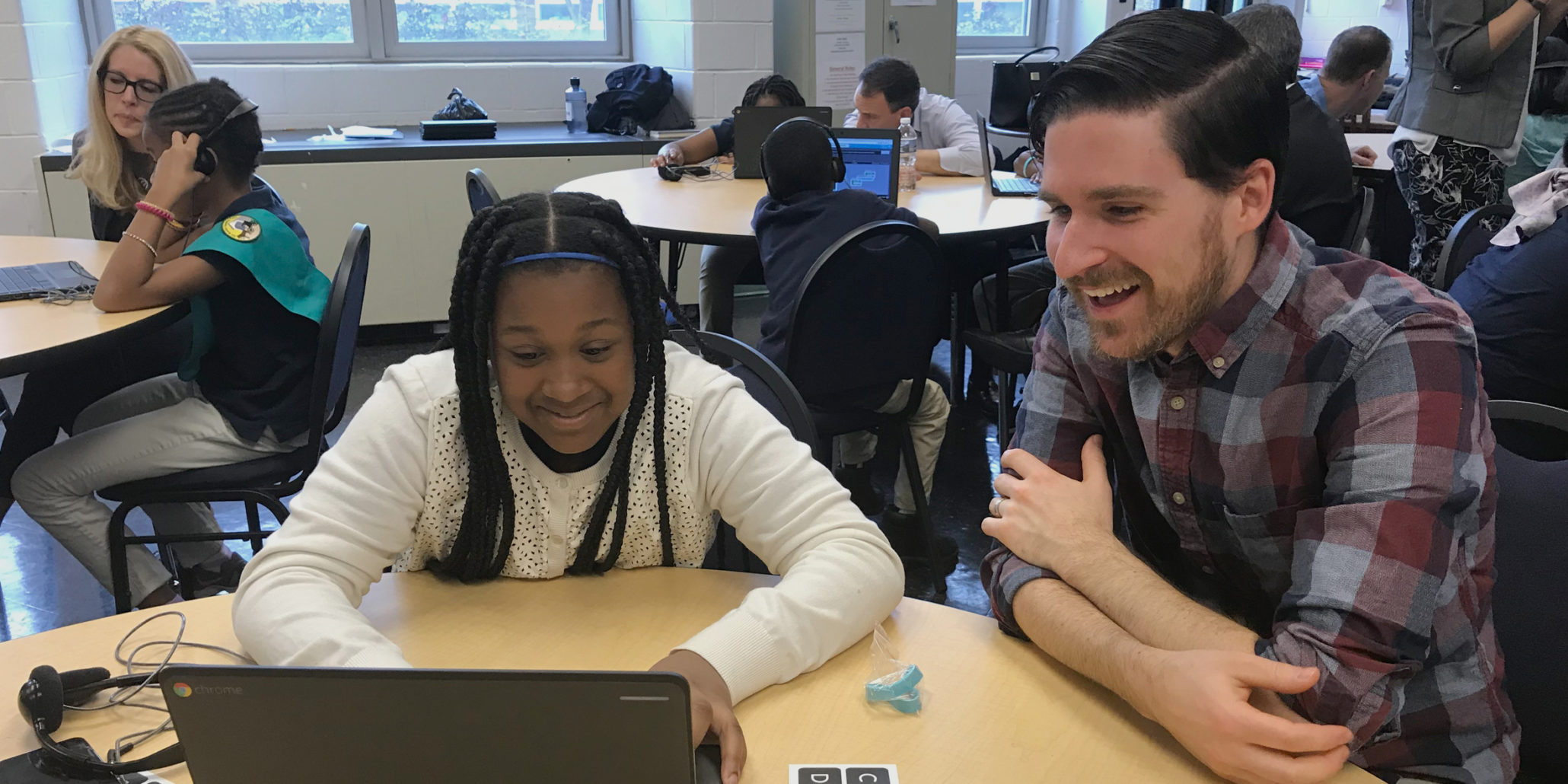 photo of Brendan McKeown helping student code