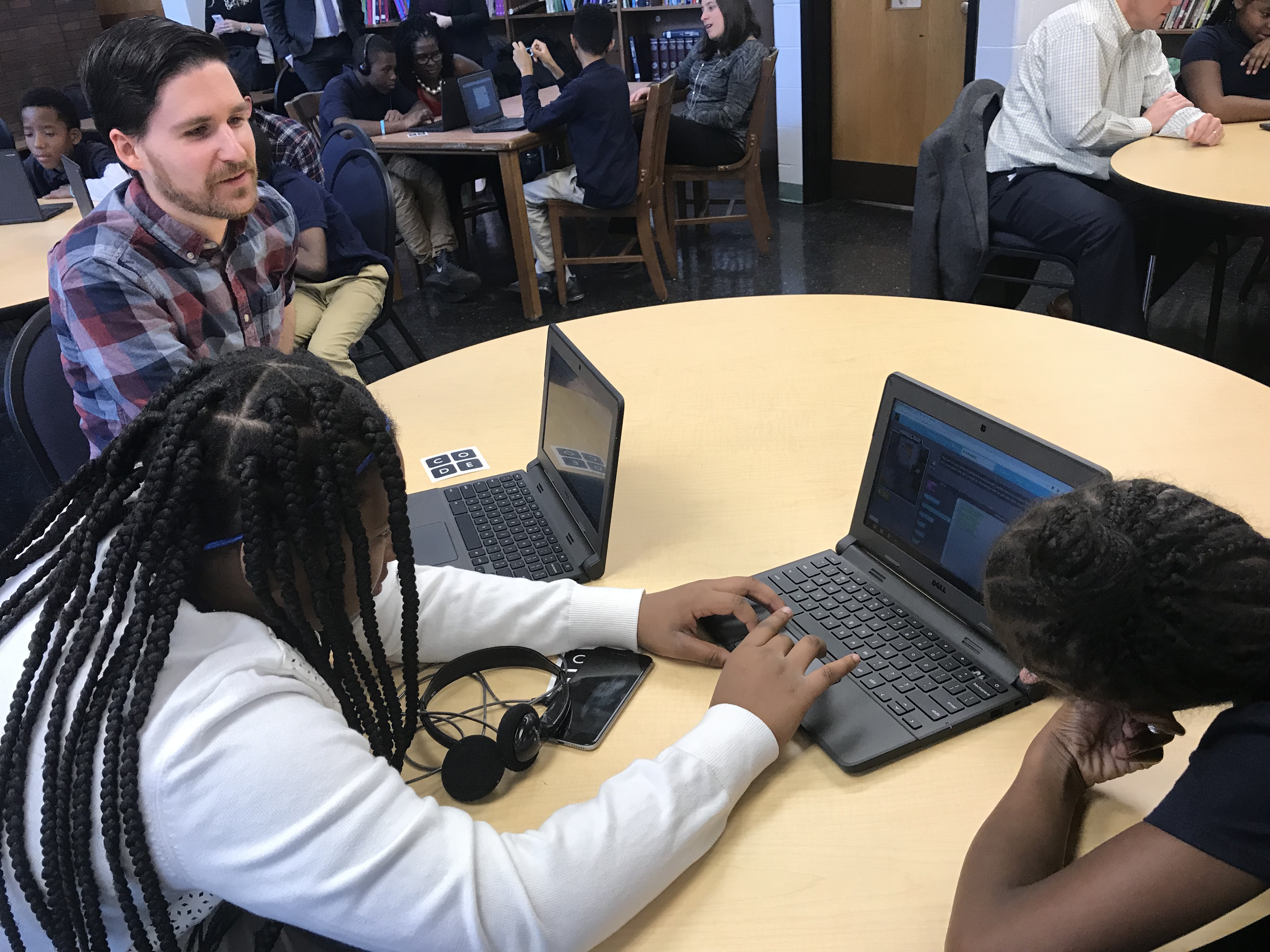 Think company senior developer Brendan McKeown helps students sort out the fine points of pair programming