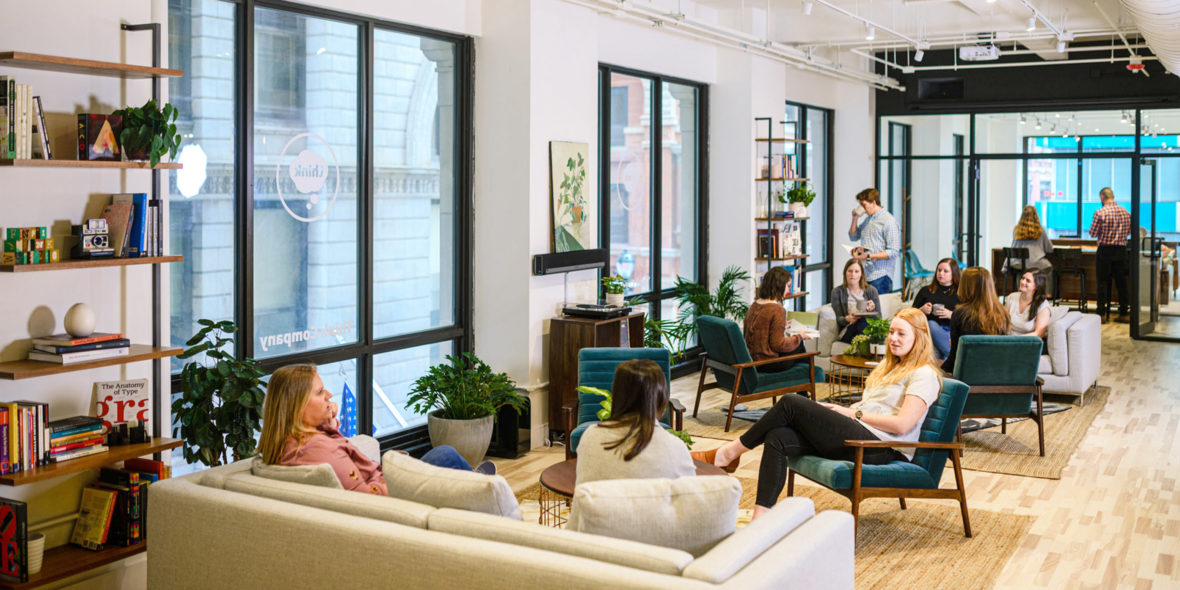 Photo of employees in a modern office lounge