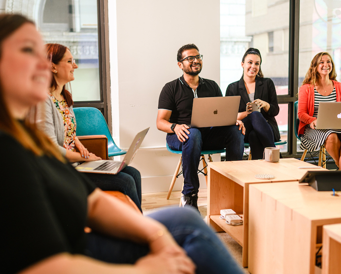 a group of people watching a presentation