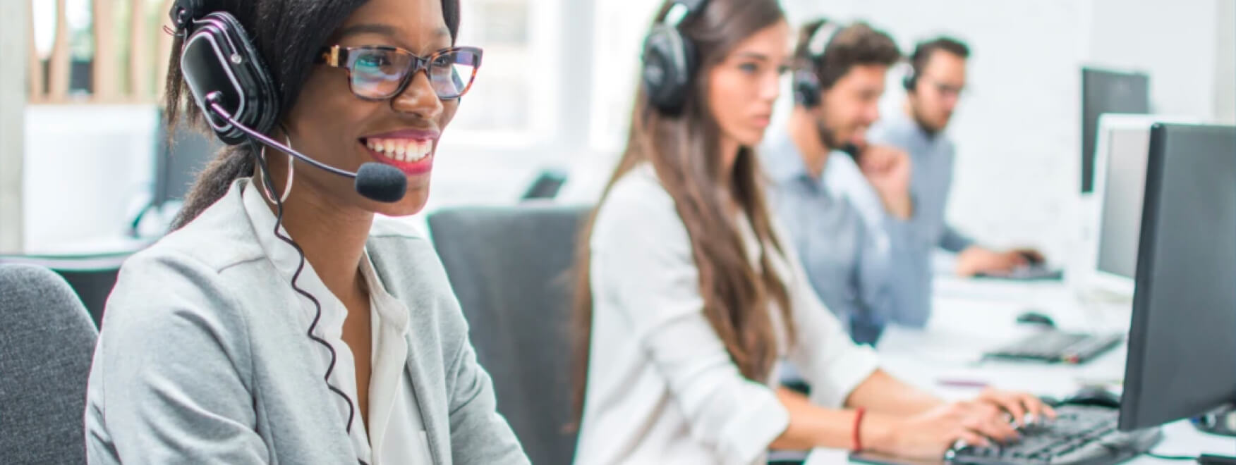 people in a call center working at computers