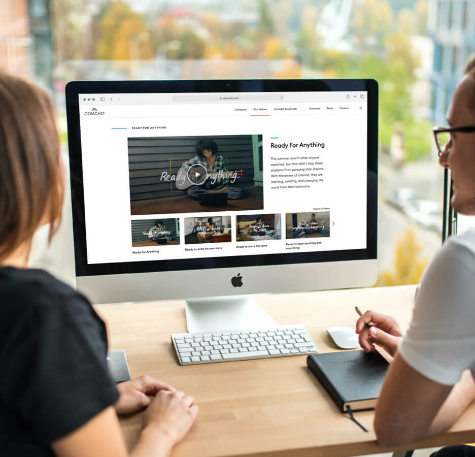 two people watching a video on a screen