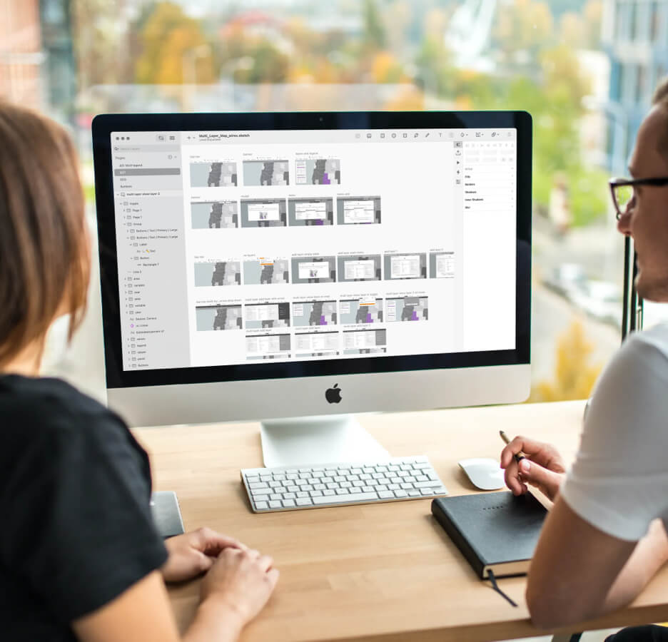 People looking at mapping interface on a screen