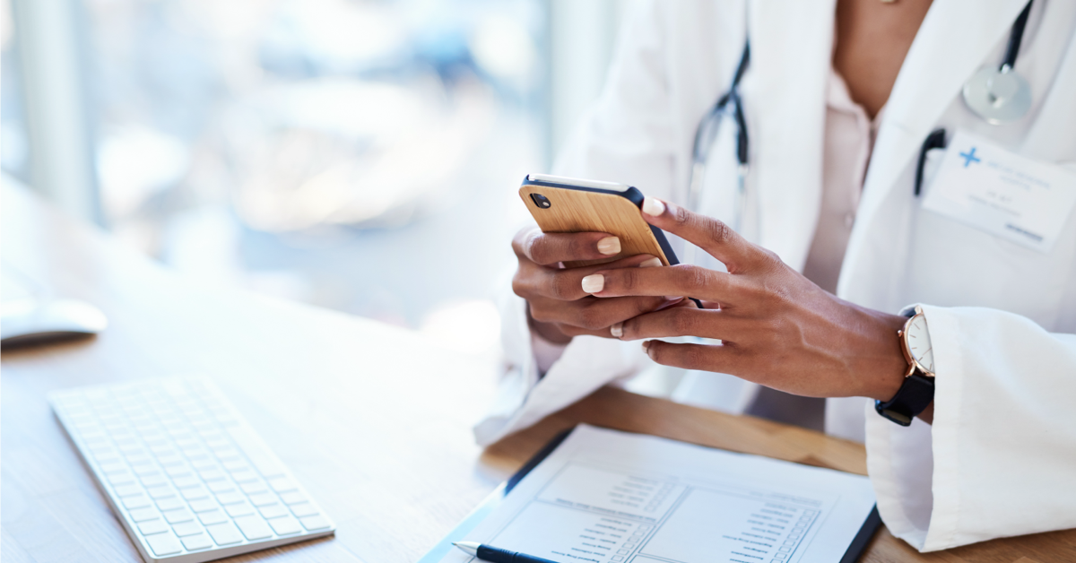 health care provider using her phone to look up medical information