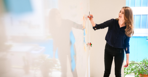 Person writing on a whiteboard