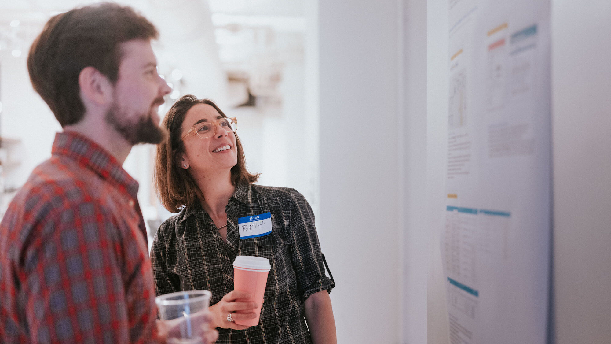 Two people looking at a project printout