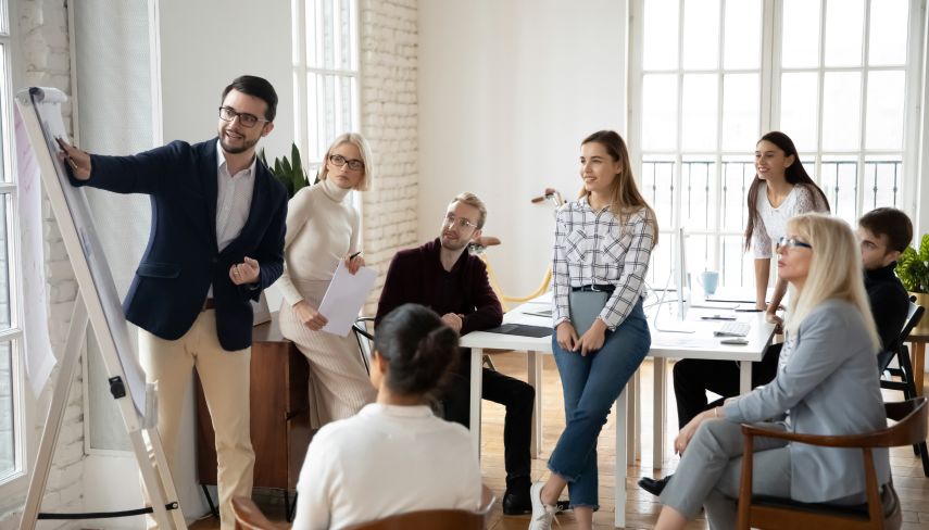 People in a meeting working on a chart