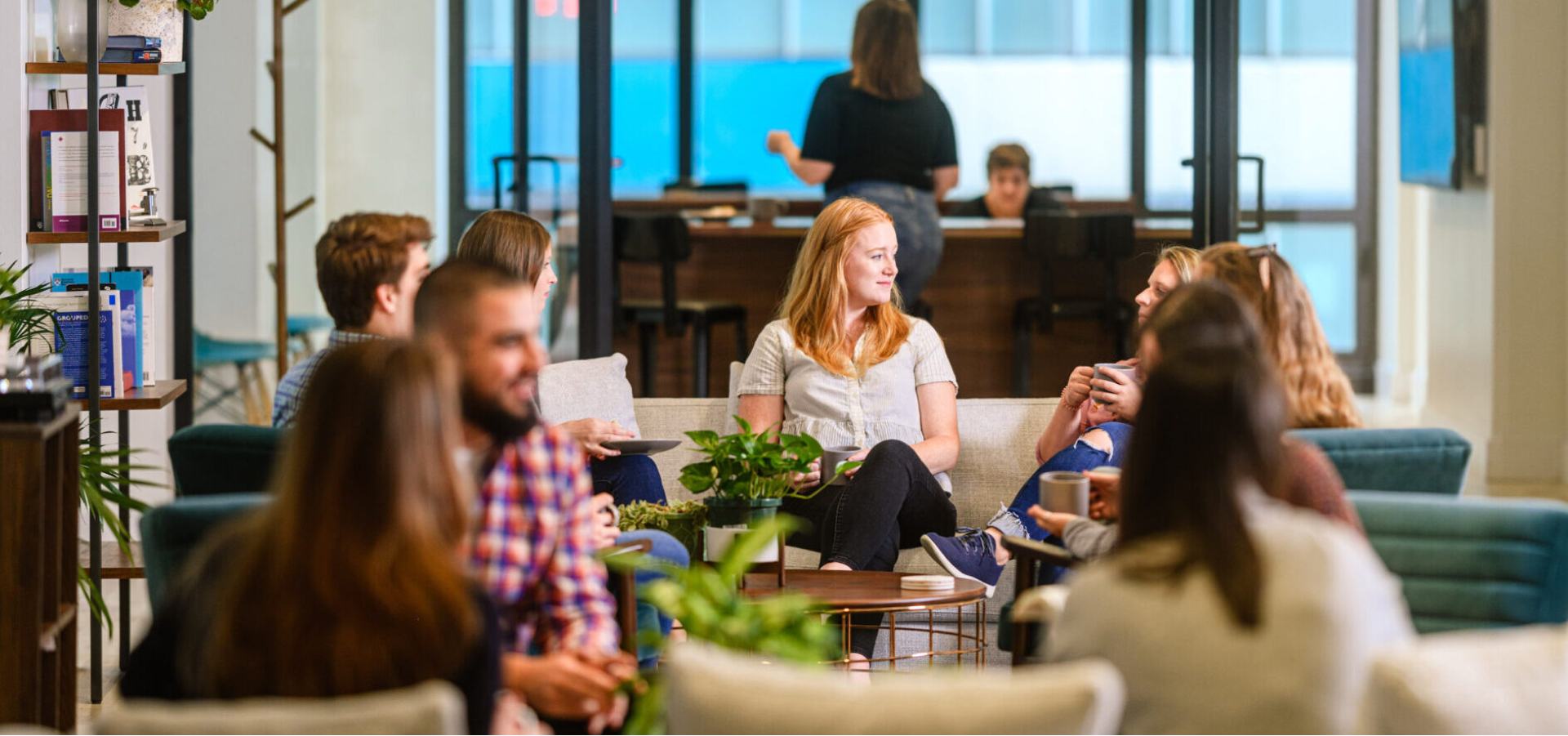 group of people socializing around couches