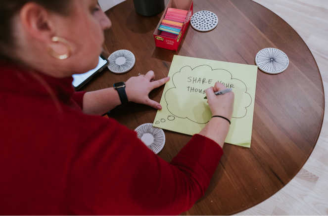 person sketching on table