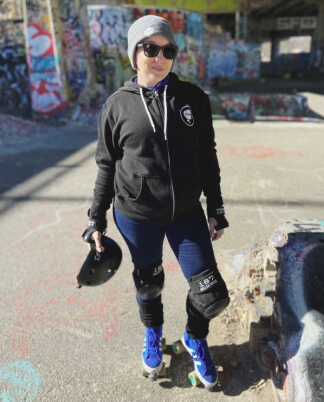 person wearing rollerblades at a skatepark
