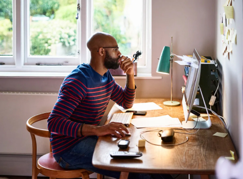 person working at a computer desk