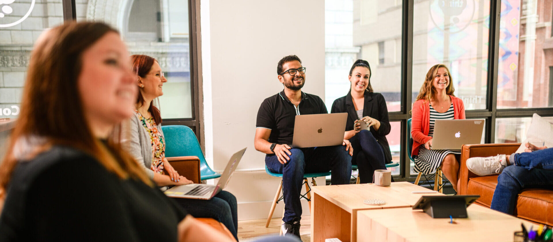 Group of people collaborating happily together