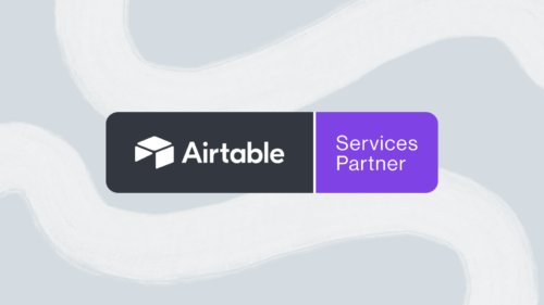 Hero image with the official Airtable Services Partner badge