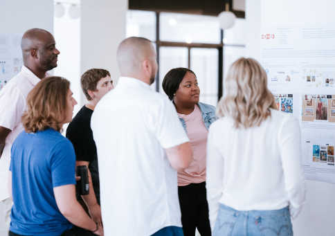 A diverse set of Designers and Technologists discussing a project