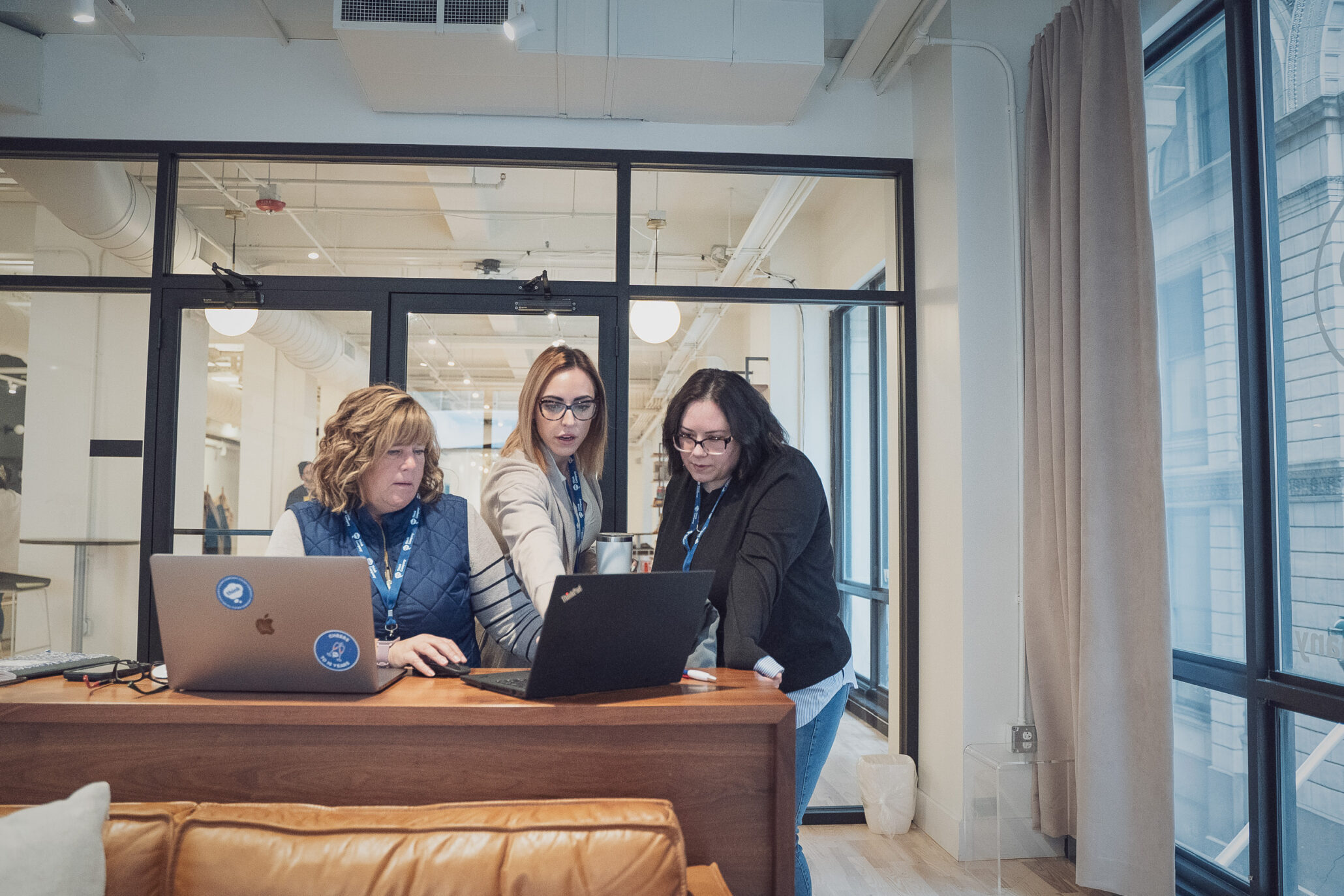 Healthcare UX designers and content strategists collaborating with a laptop